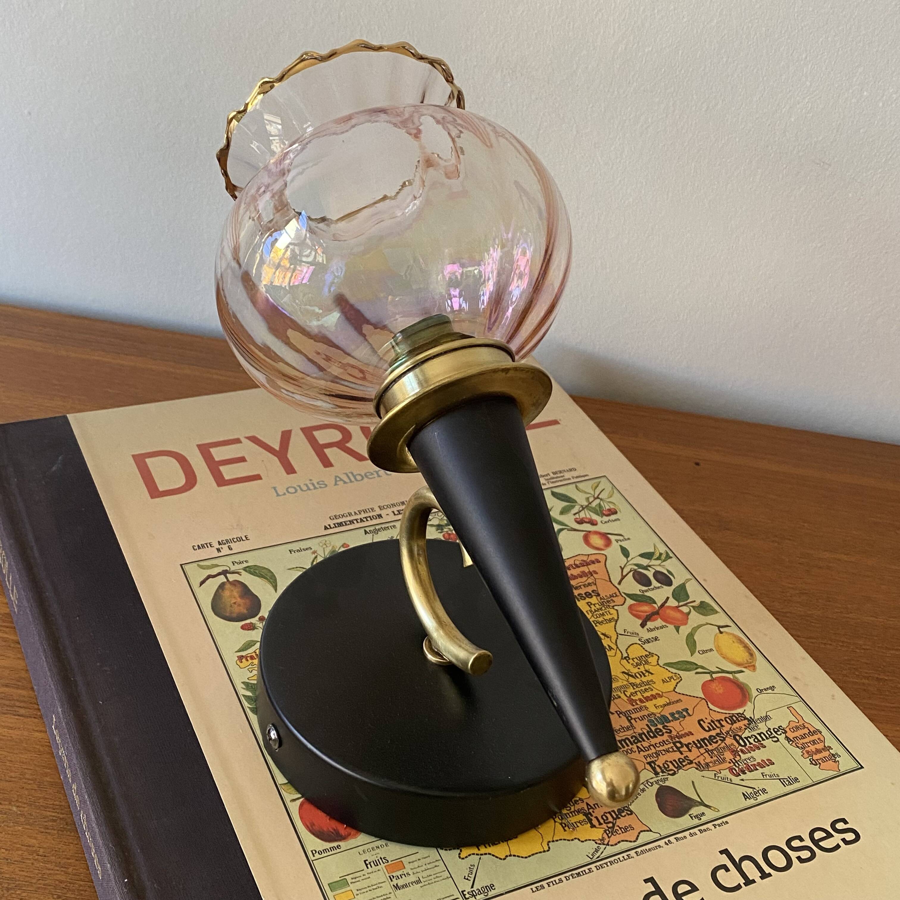 Pair of torch wall lights with iridescent pink glass shades and gold trim.