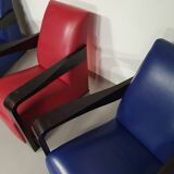 4 x Vintage Ying lounge chairs / fauteuils van Hugues Chevalier,'90. 3 x blue / 1 x red leather
