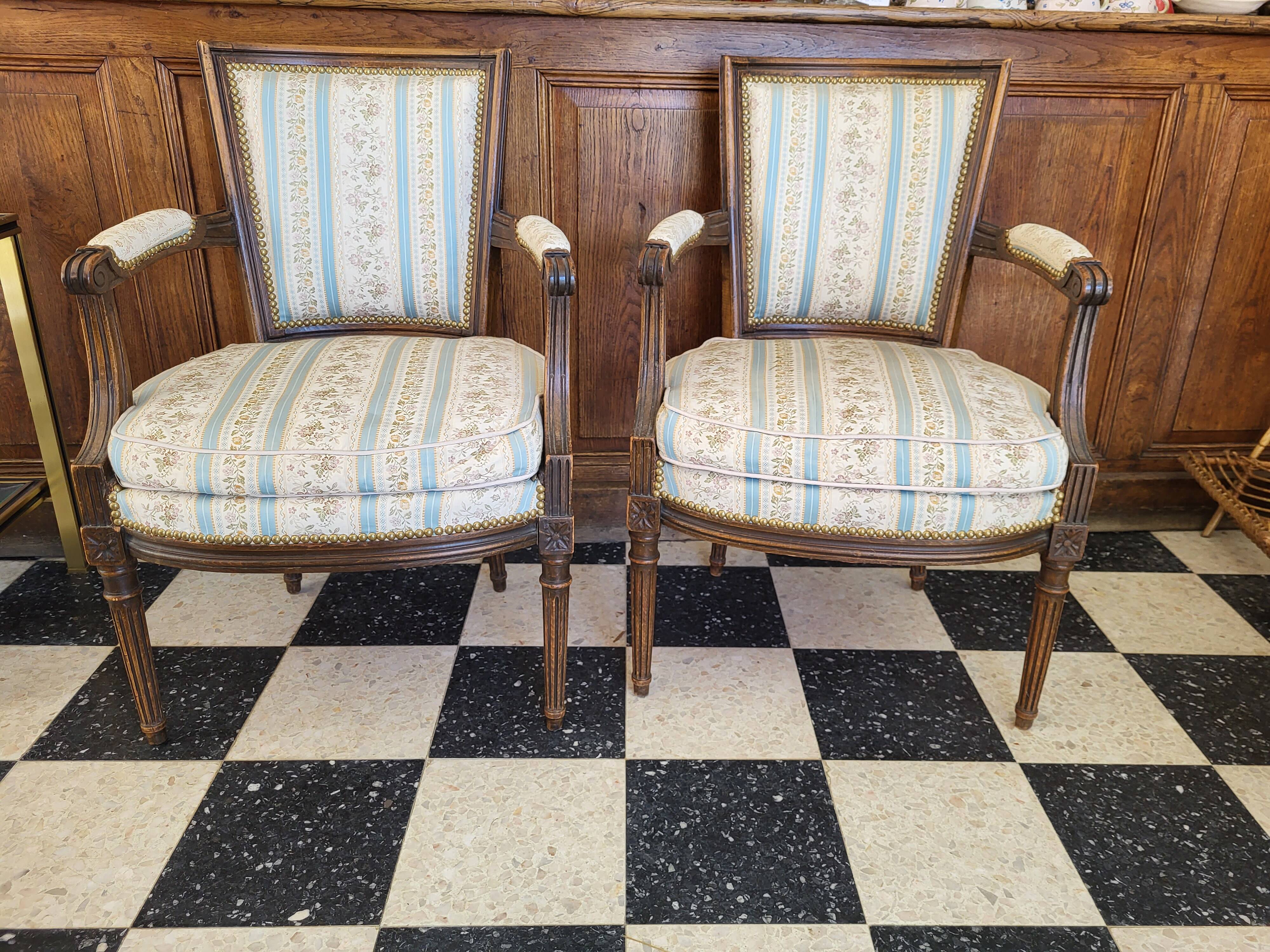 Pair of Louis XVI era convertible armchairs