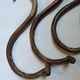 Set of curved wooden coat hooks in Thonet style.