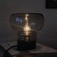 Sciolari table lamp with smoked glass globe and black plastic base.