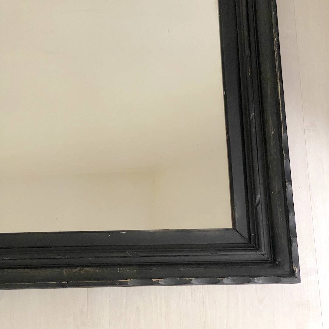 1950s mirror, matte black wood with a patina.