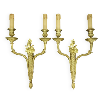 Pair of large wall sconces with flowers in the Louis XVI style from the 19th century - gilded bronze.
