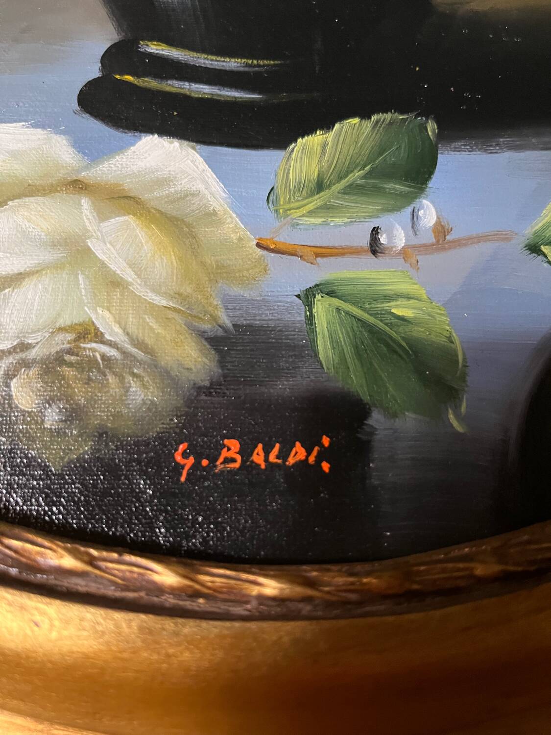 Large still life with white roses in an old gilded oval frame.
