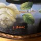 Large still life with white roses in an old gilded oval frame.