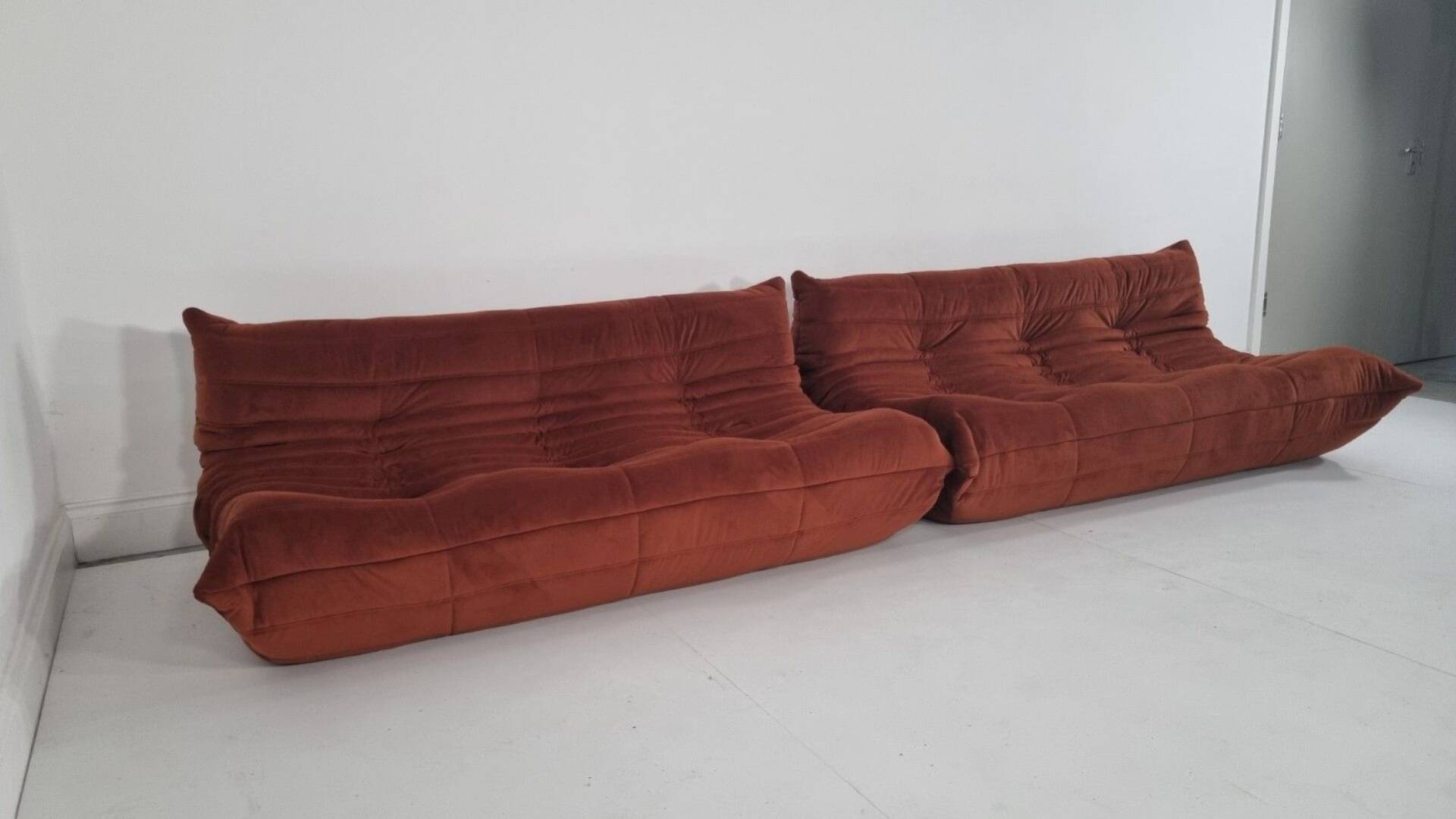 Ligne Roset Pair of 3-seater Togo sofas in rust velvet