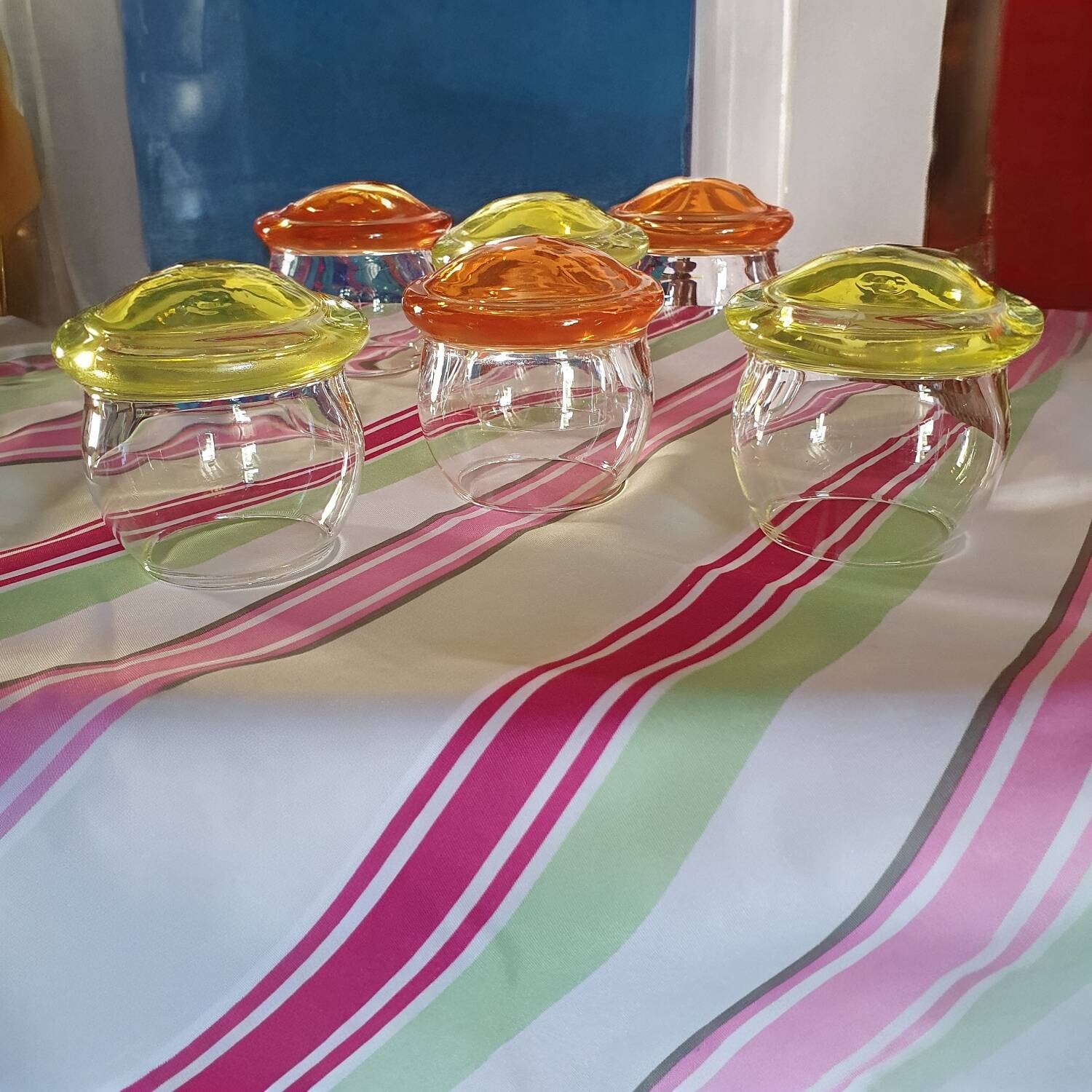 6 Glasses with the name Culbuto in 3 orange colors and 3 lemon yellow colors