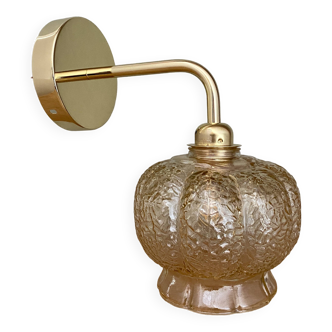 Vintage globe golden angled wall lamp in amber glass