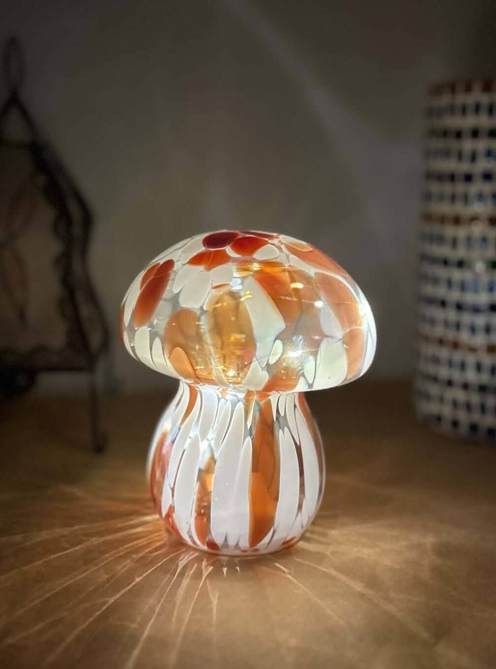 Mosaic glass mushroom lamp in orange, white, and clear.