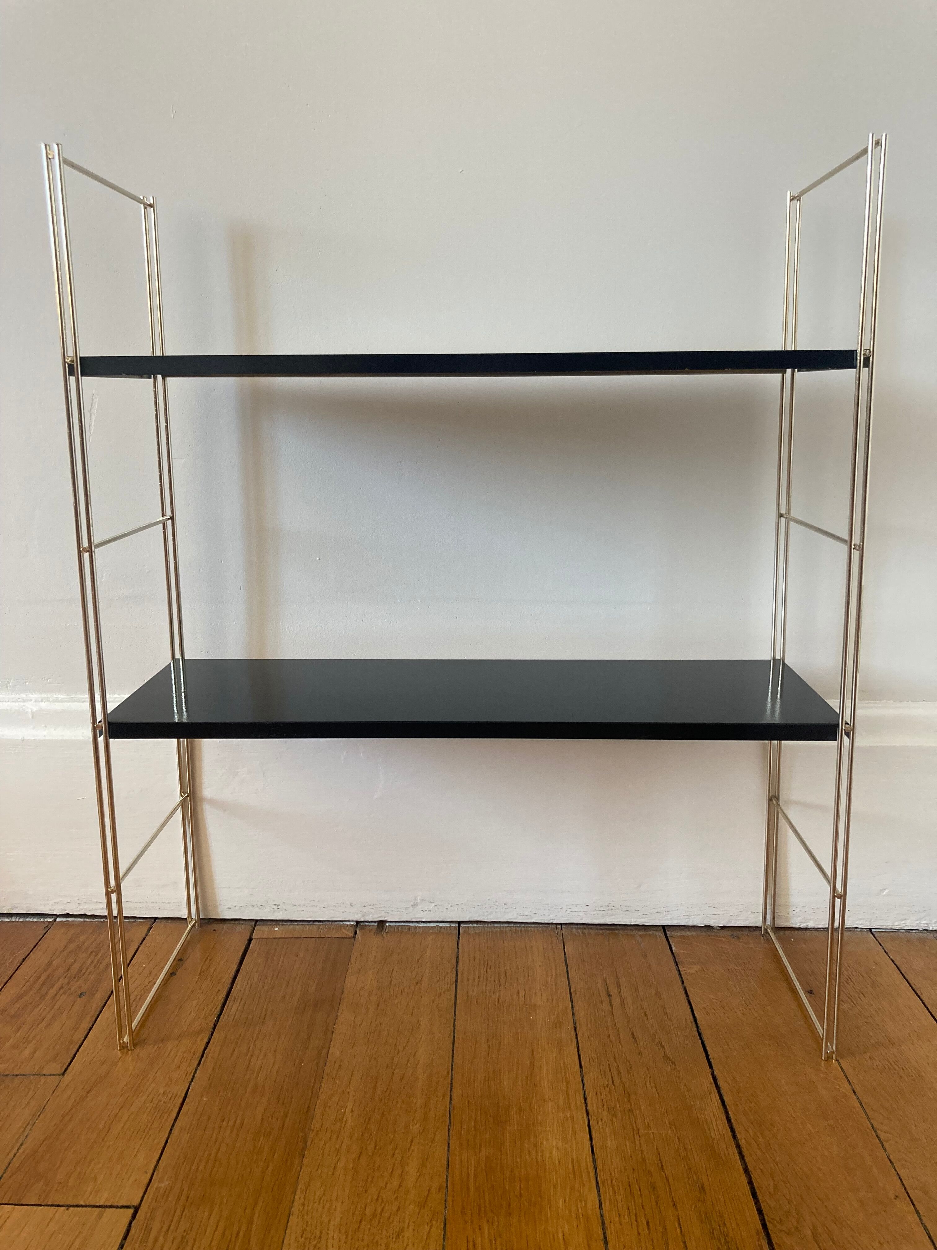 Black and gold string shelf