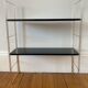 Black and gold string shelf