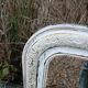 Antique mirror with carved wooden frame