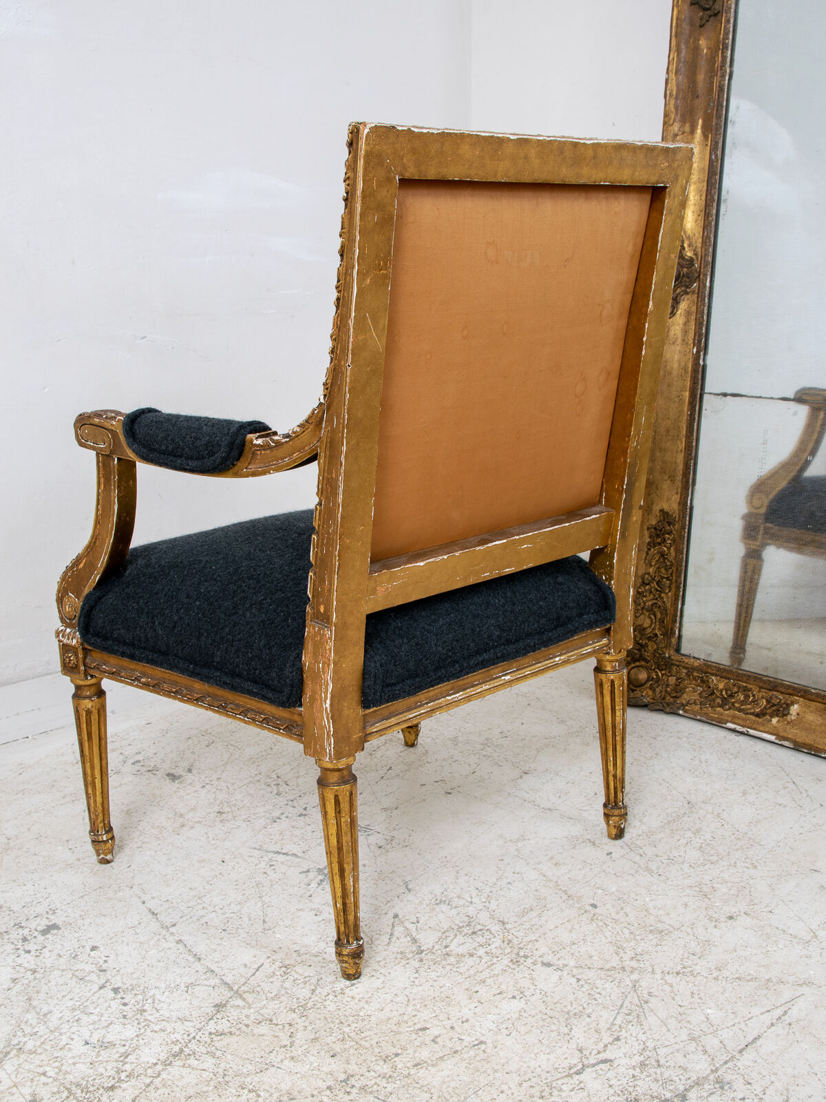 Pair of 19th century Louis XVI gilt armchairs newly re upholstered in holland and sherry fabric