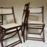 Set de quatre chaises pliantes en bois et cannage