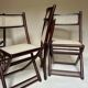 Set de quatre chaises pliantes en bois et cannage