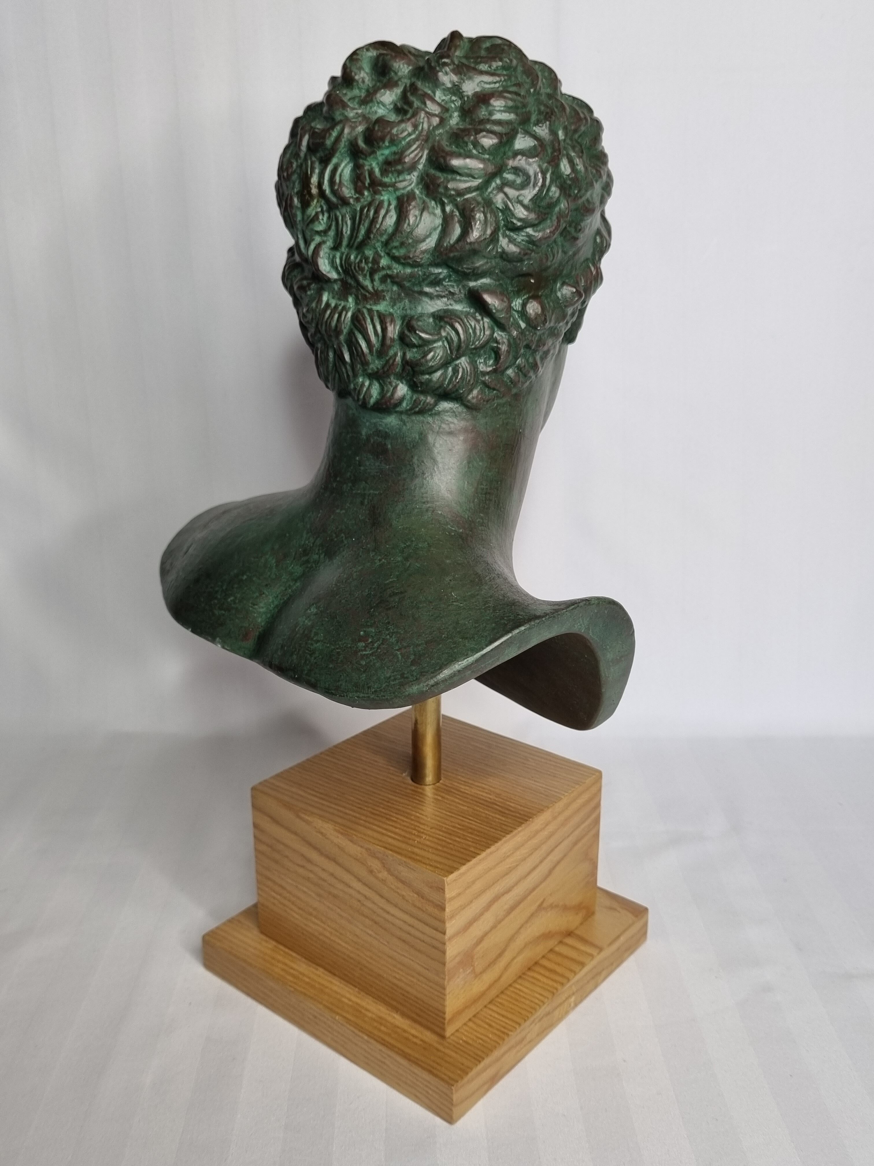 Bust of the Ephebus of Marathon in patinated plaster on base