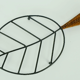 Danish modern leaf-shaped coaster metal and leather 1950s 60s