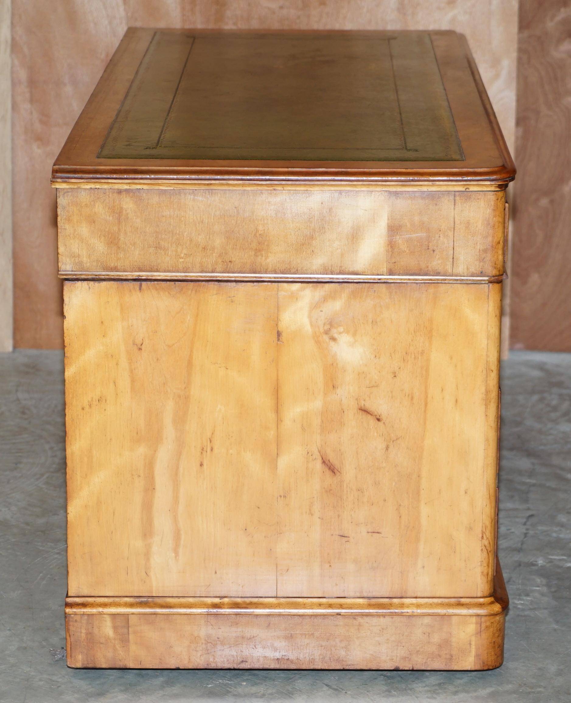 Antique desk by James Winter & Sons London in satin wood and leather.