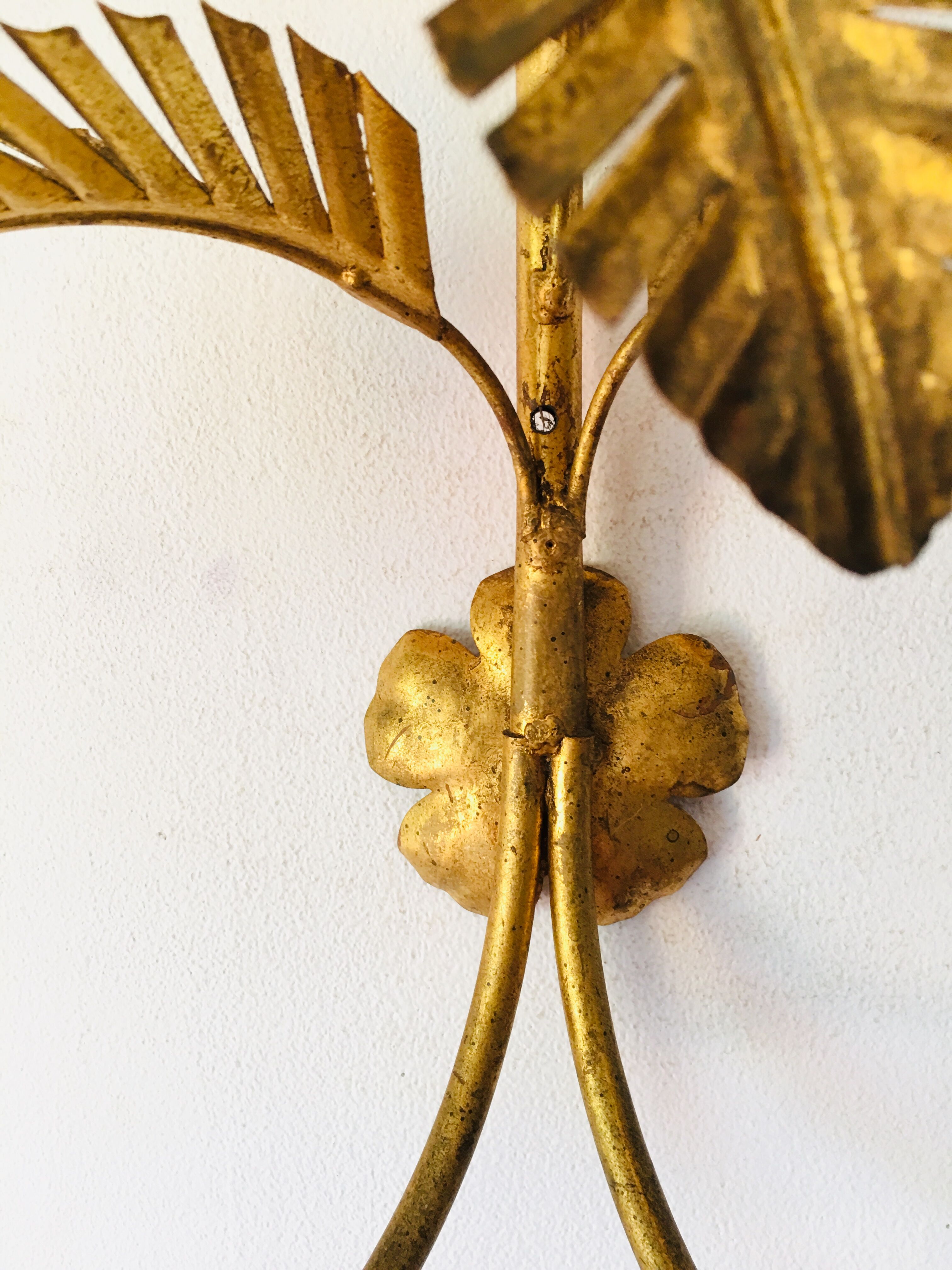 Golden palm leaf sconce