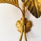 Golden palm leaf sconce