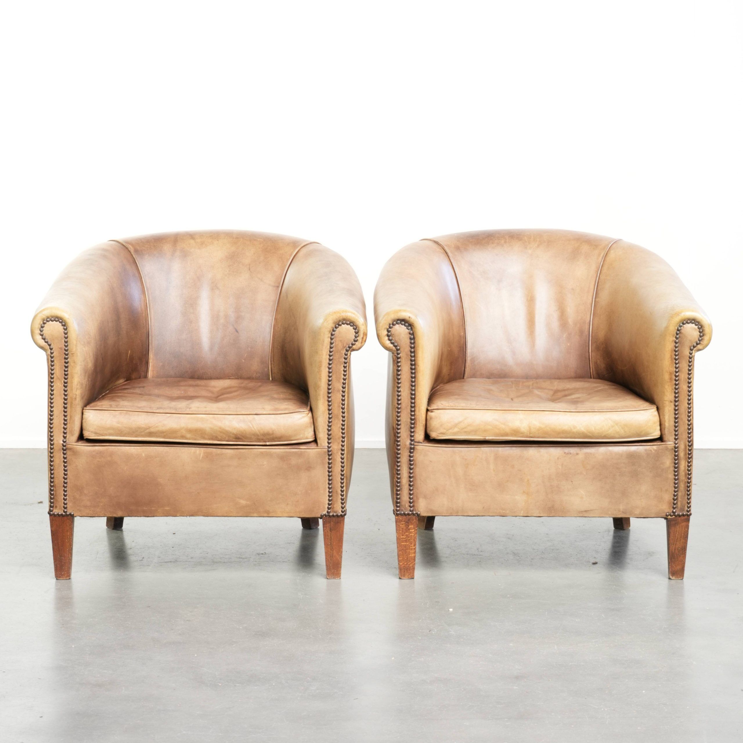 Set of two vintage cowhide club armchairs in English style