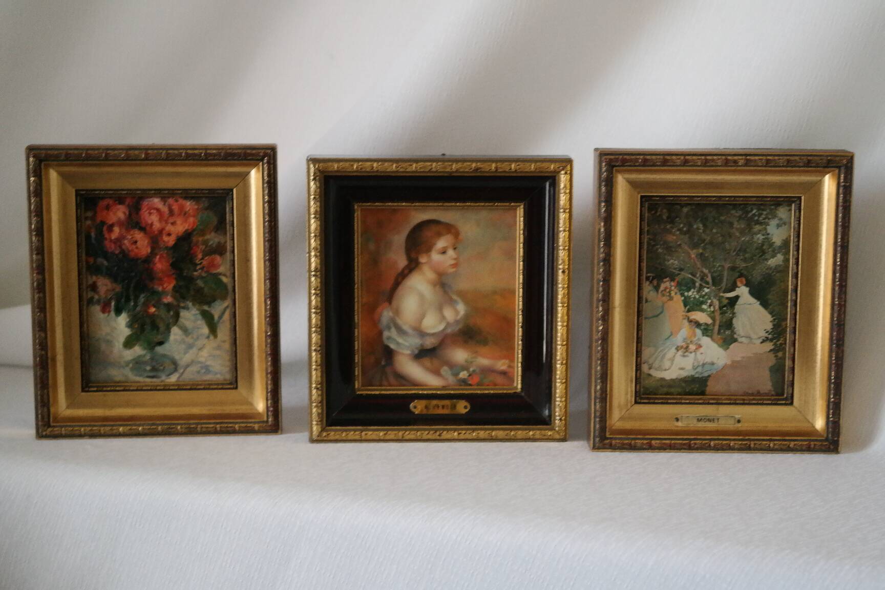 Trio of reproductions of famous vintage painters' tableaux.