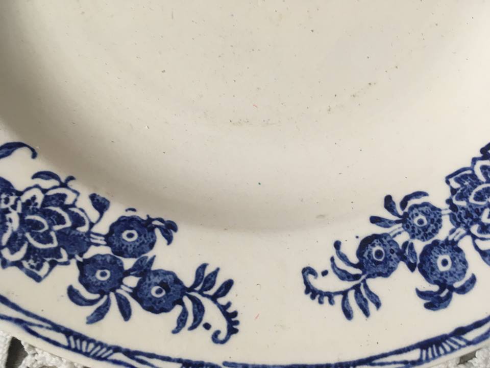 Six soup plates don't match in red and blue