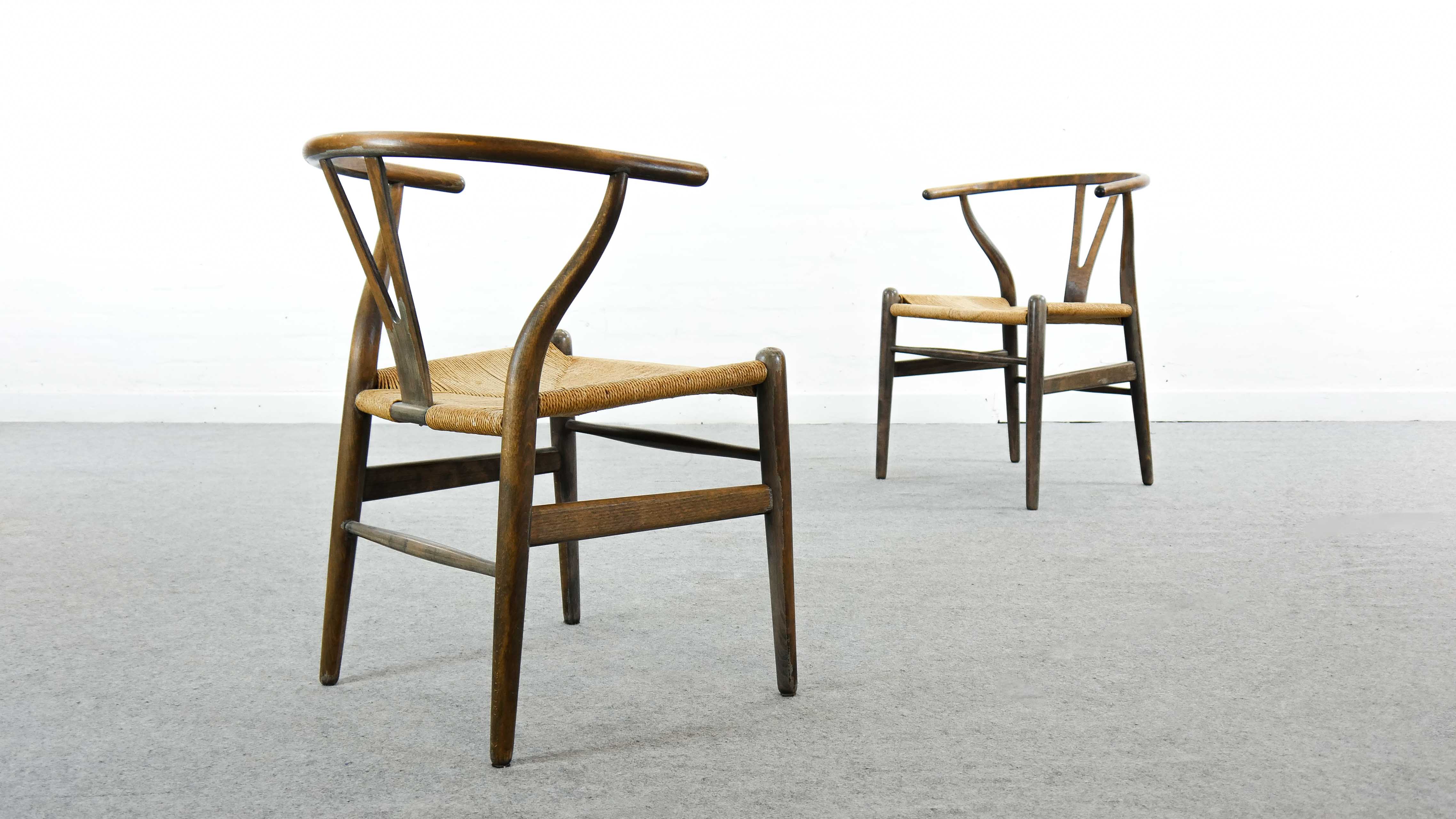 Pair of CH24 wishbone dining chairs by Hans Wegner for Carl Hansen Denmark