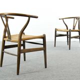 Pair of CH24 wishbone dining chairs by Hans Wegner for Carl Hansen Denmark