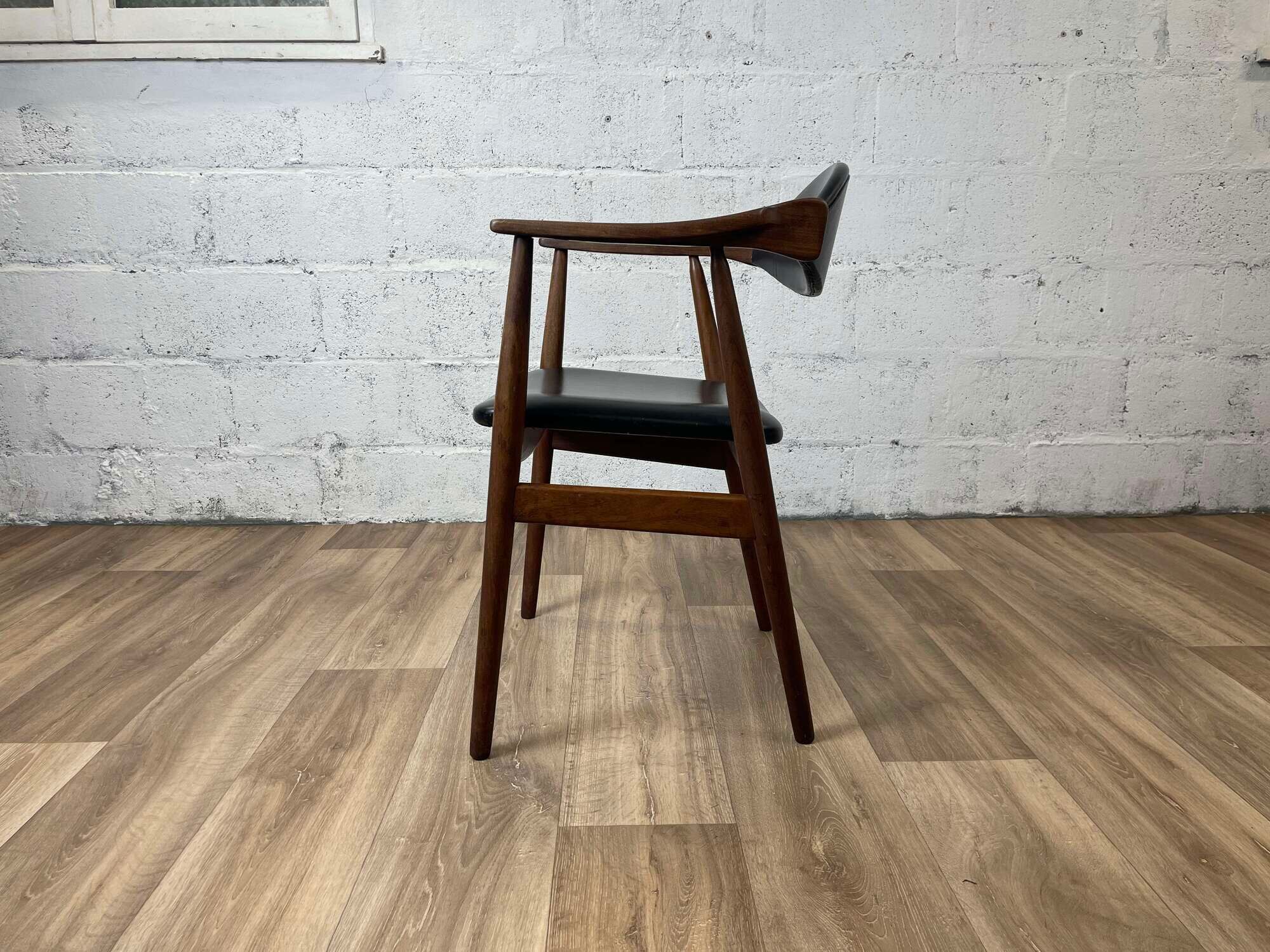 Vintage Scandinavian armchair in teak and black skai, 60s