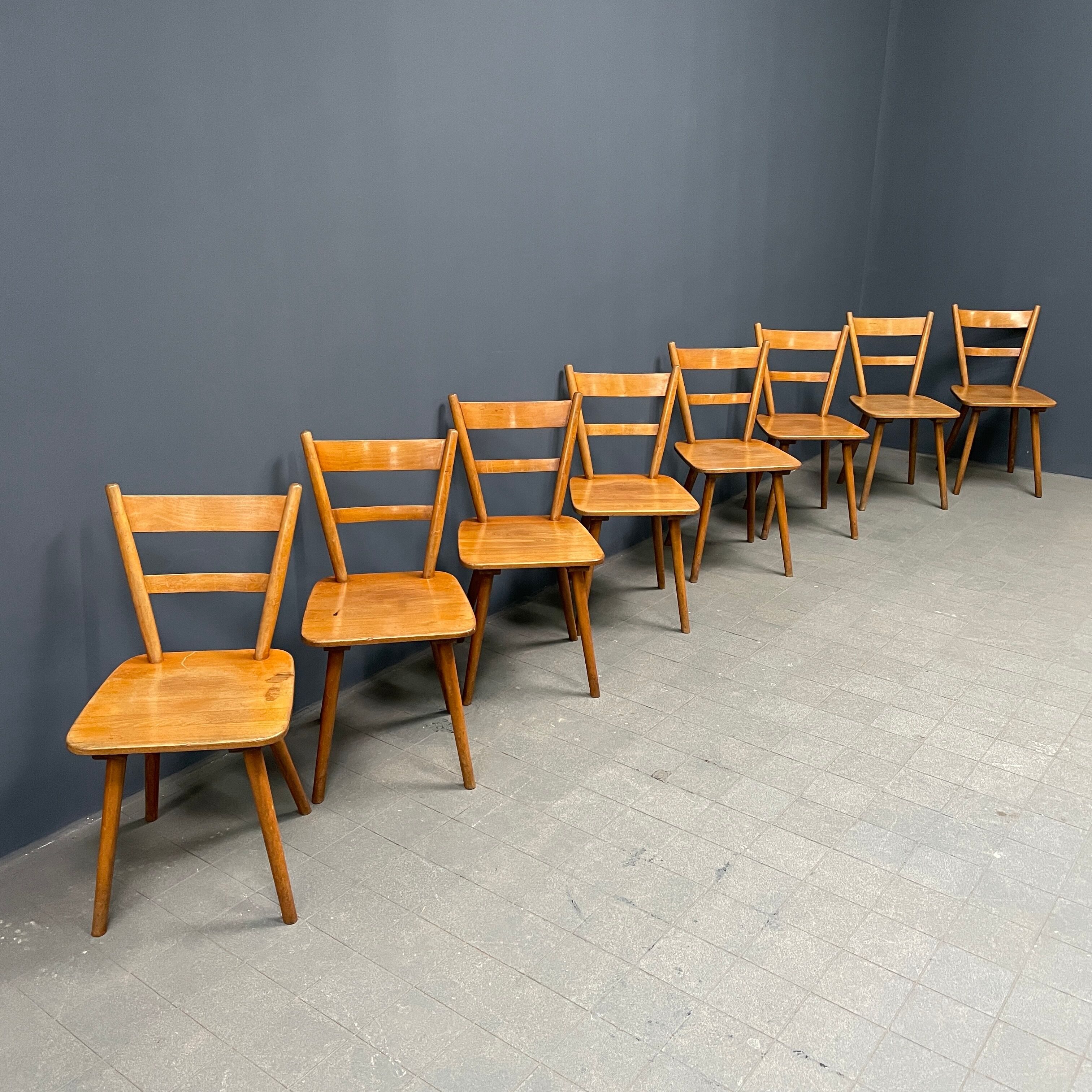 Set of eight german stick chairs from the 1950