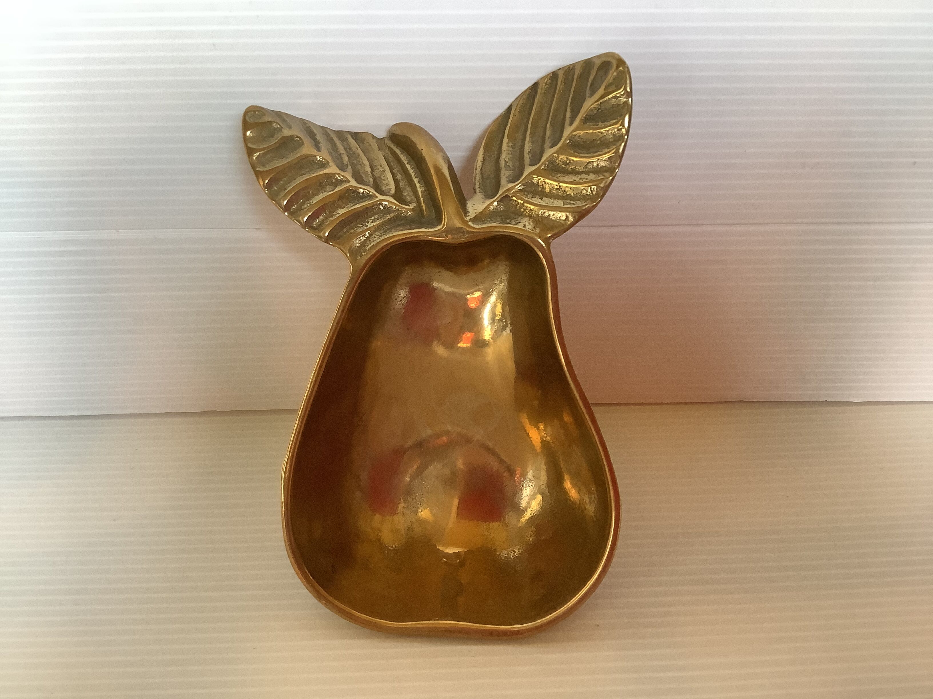 Empty pocket pear fruit brass