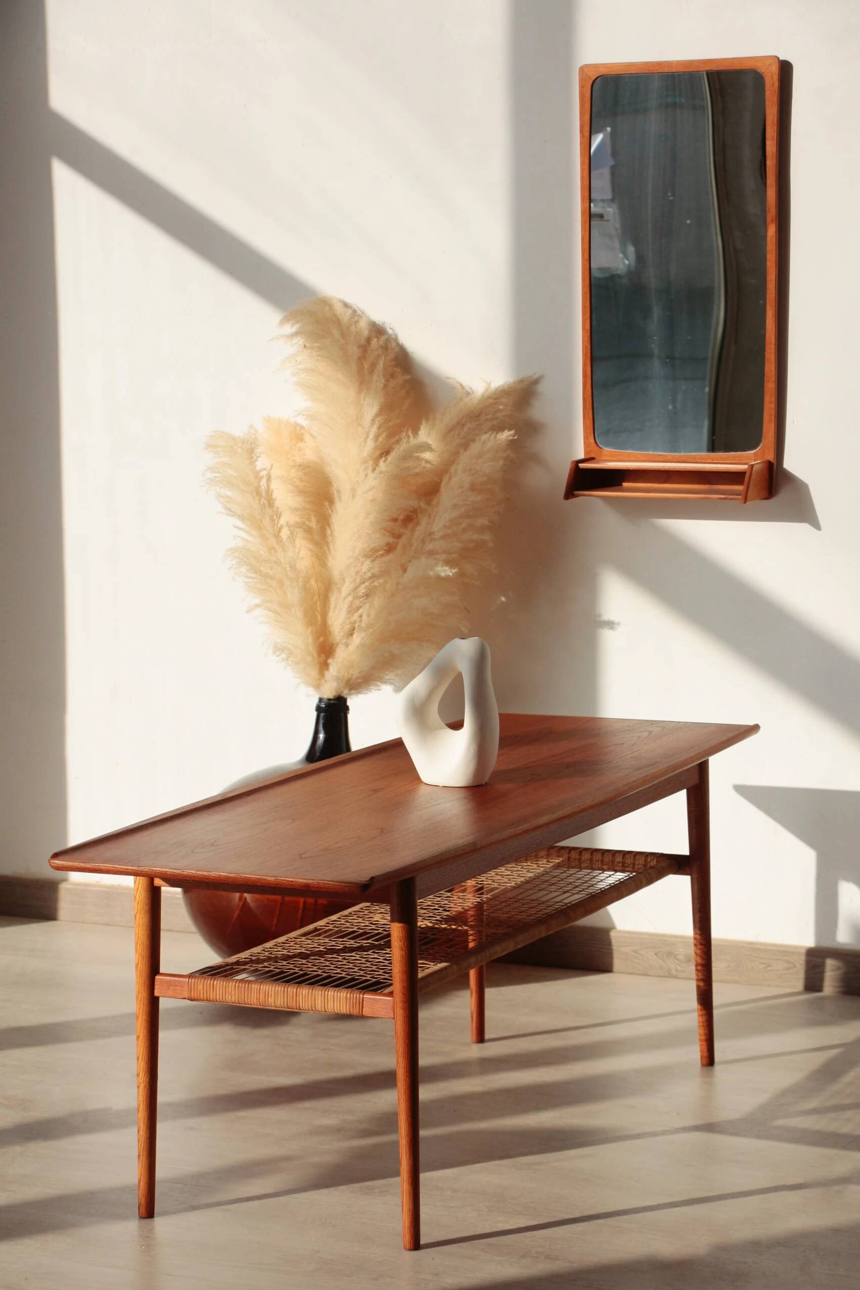 Vintage Scandinavian coffee table in teak and rattan – Danish design from the 1960s.