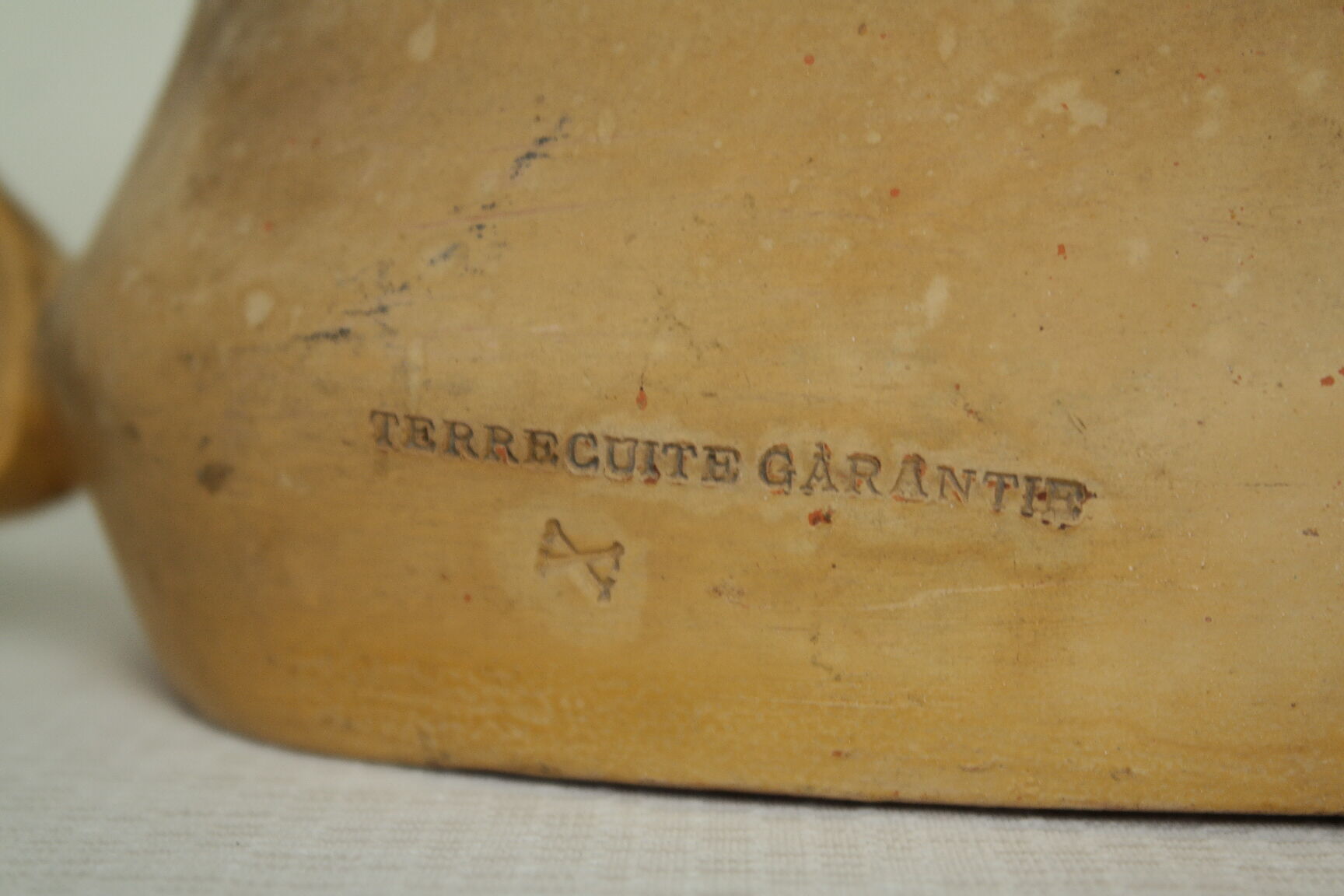 Art Nouveau jardinière with bas-reliefs in terracotta.