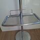 Vintage chrome metal floor ashtray with integrated tray.