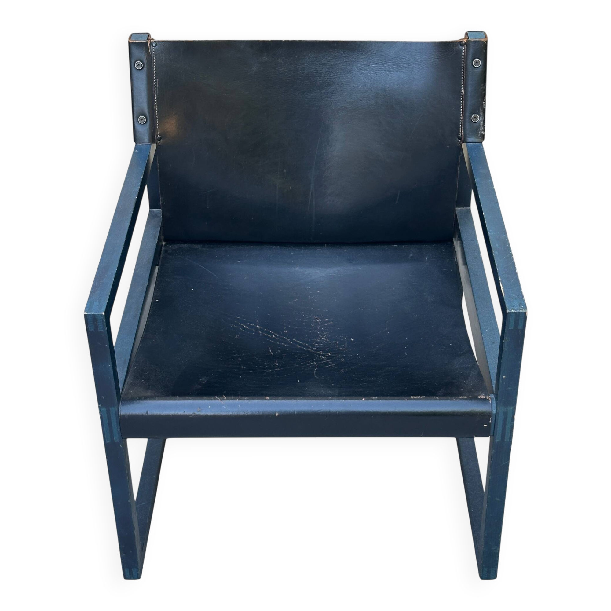 Postmodern lounge chair in black saddle leather and midnight blue wood, 1980.