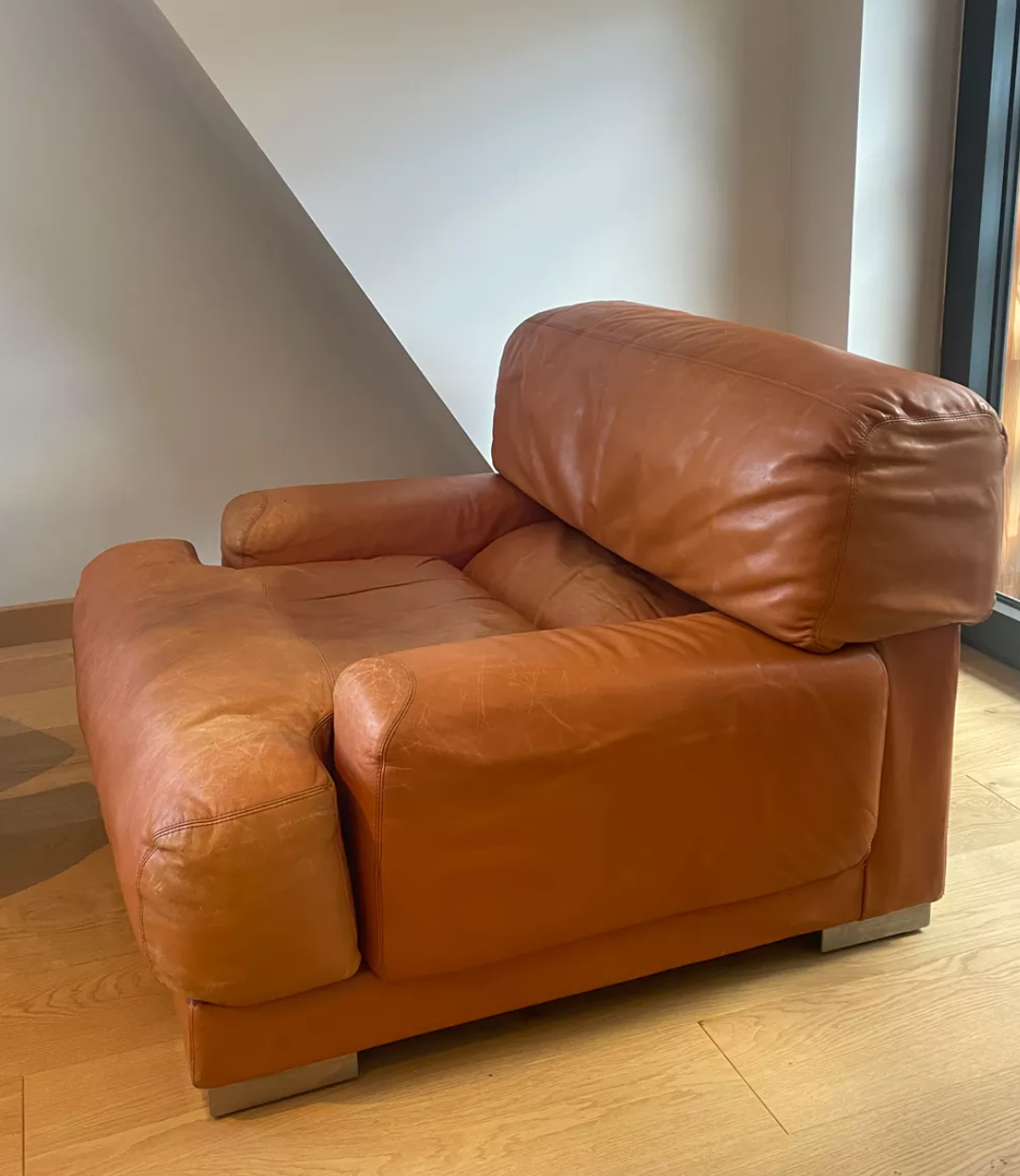 Pair of vintage armchairs Gérard Guermonprez tawny leather and stainless steel, France 1970