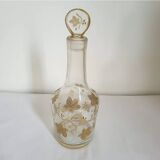 Old crystal carafe with golden decoration
