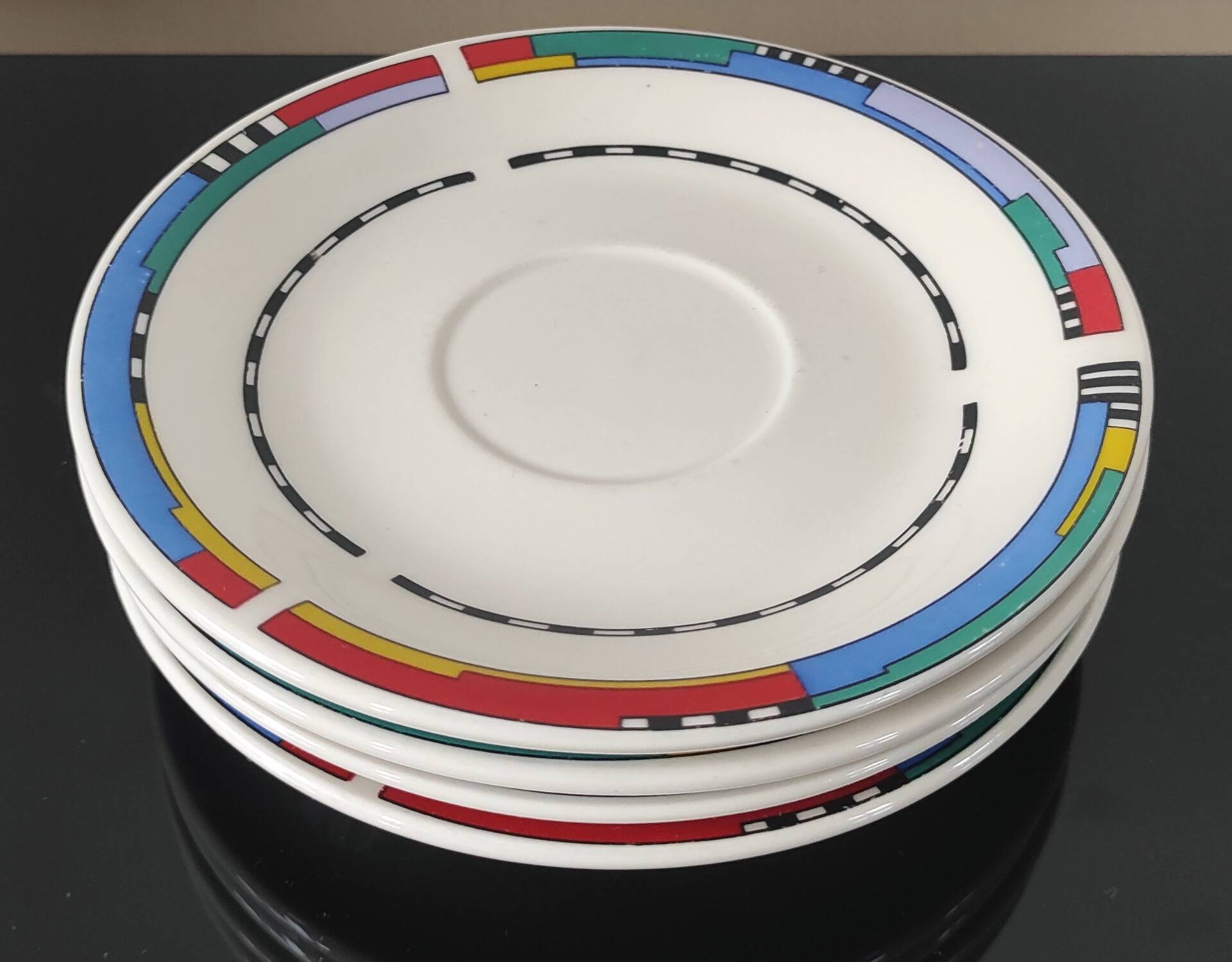 Set of small plates, vintage saucers in porcelain.