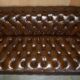 Restored Chesterfield leather sofa in vintage Art Deco style