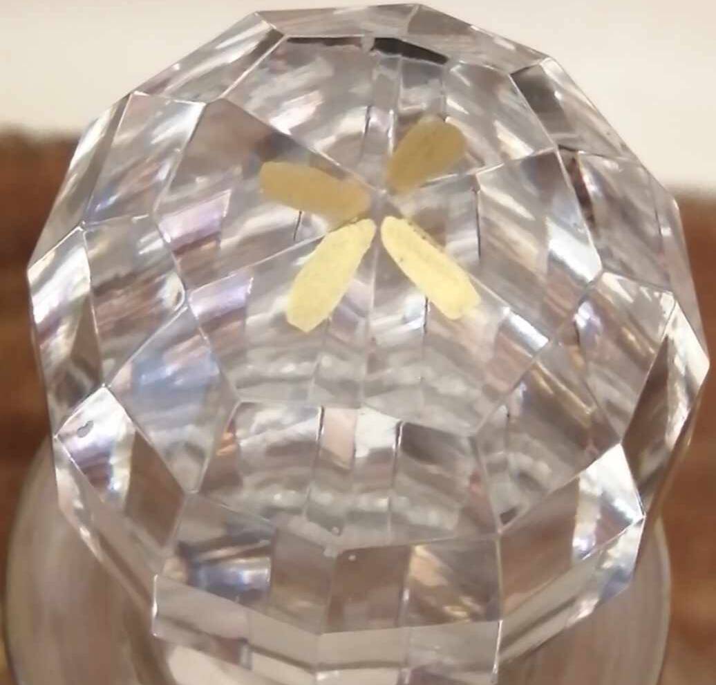 Old crystal decanter with gold decoration