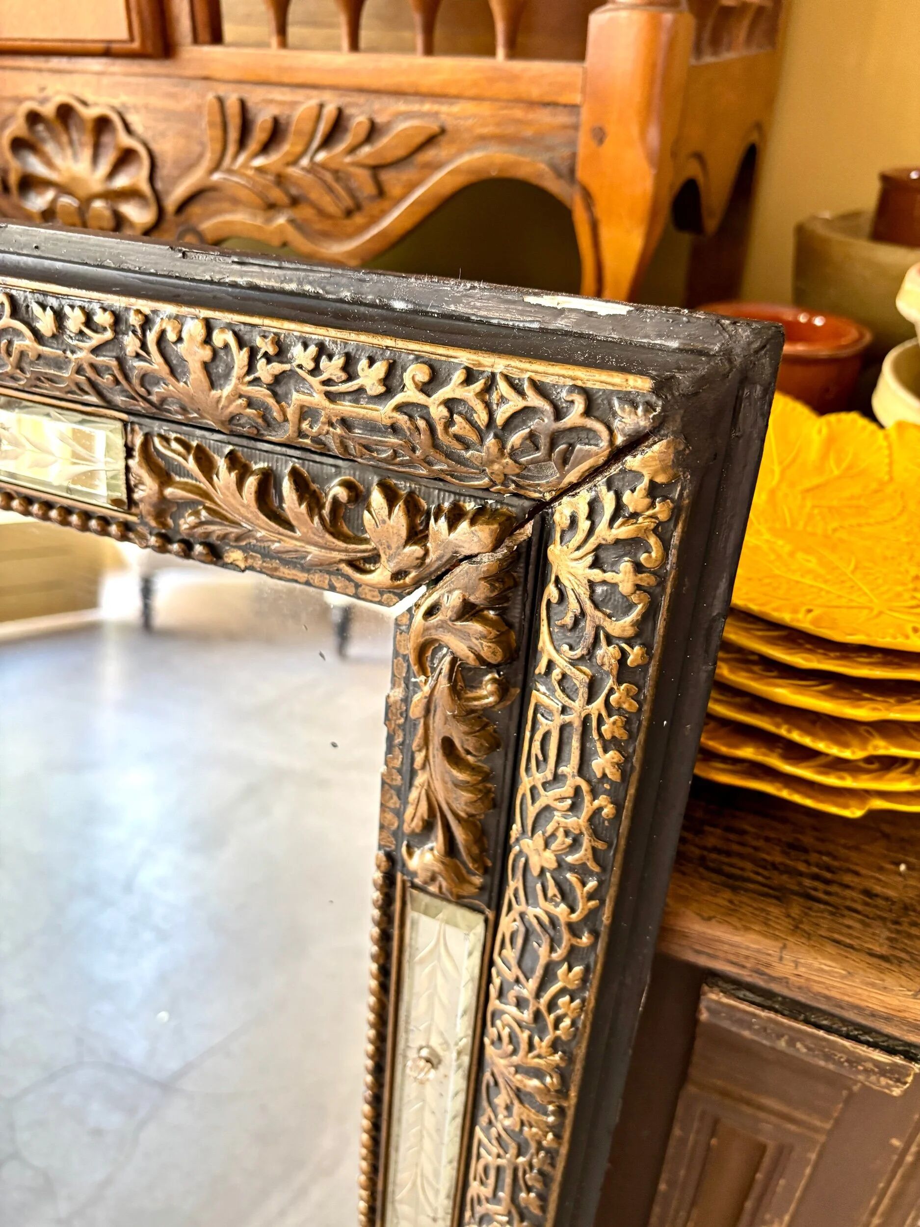 Rectangular Napoleon III mirror in moulded black and gold wood with engraved mirror decoration.