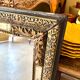 Rectangular Napoleon III mirror in moulded black and gold wood with engraved mirror decoration.