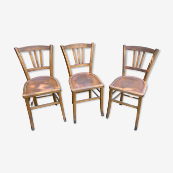 Trio of vintage oak bistro chairs
