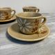 Set of 5 St Amand Autumn porcelain cups and saucers.