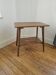 Vintage side table with double top in Scandinavian style.