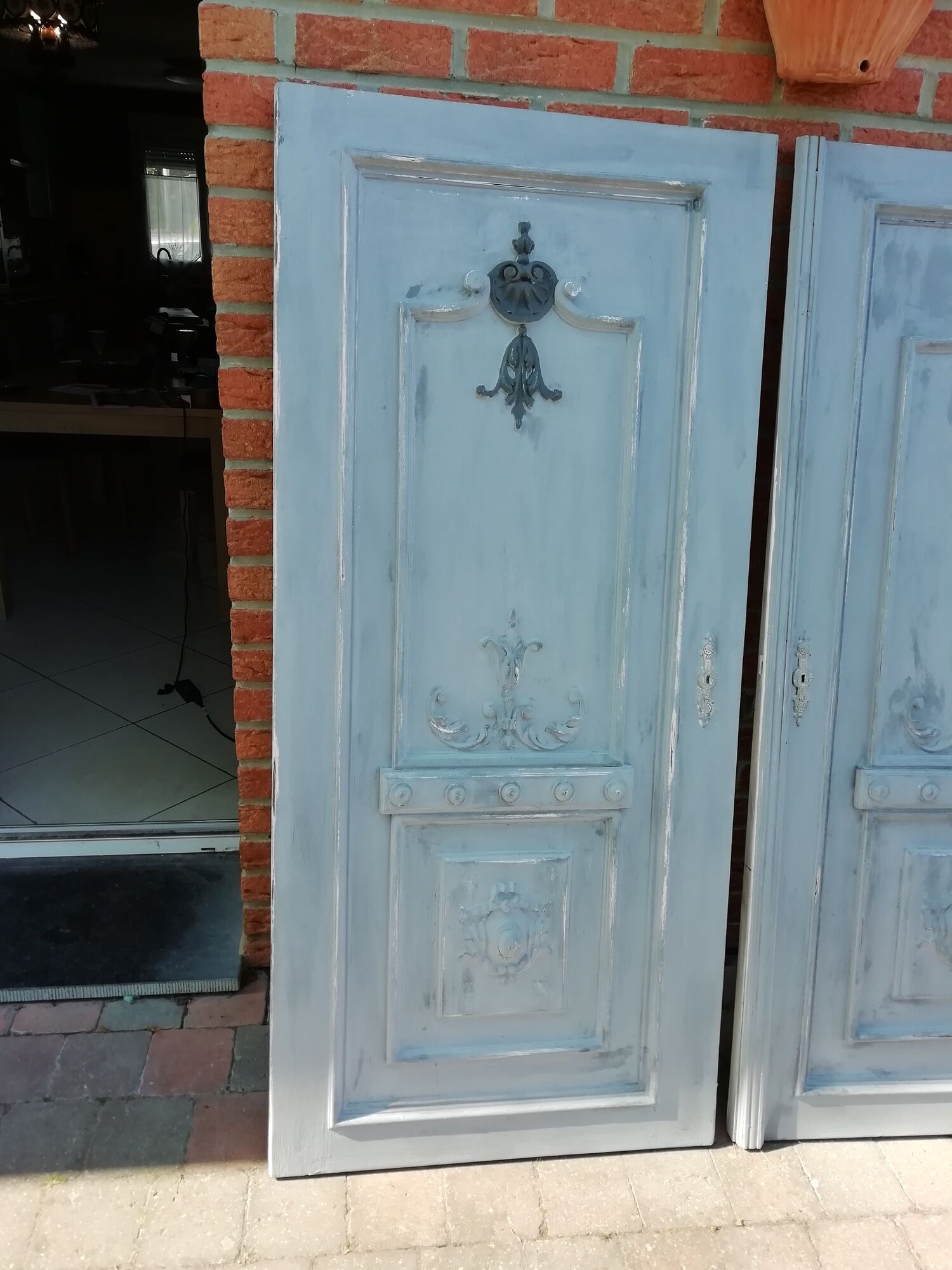 Pair of old door painted in carved wood