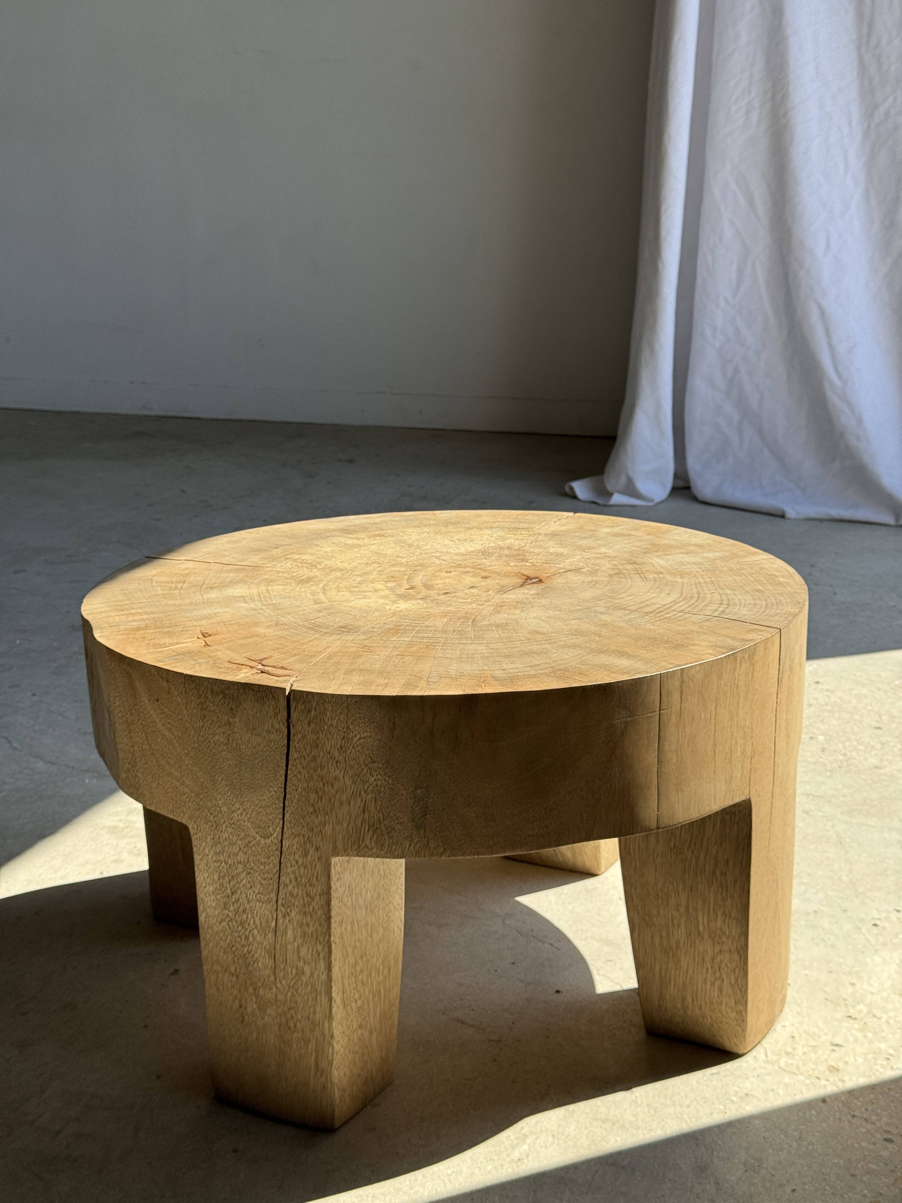 Coffee table, four-legged low table in natural solid monoxyle mango wood.