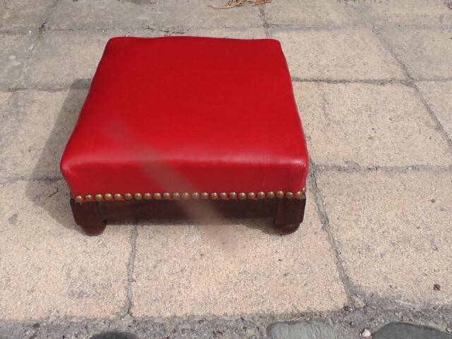 Red leather armchair and footrest