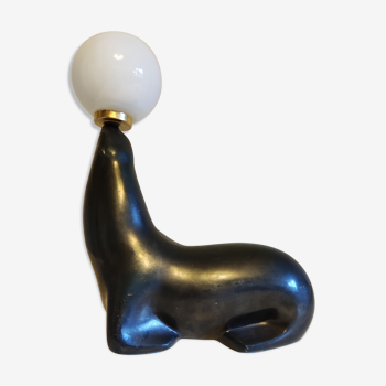 black iridescent blue terracotta sea lion lamp